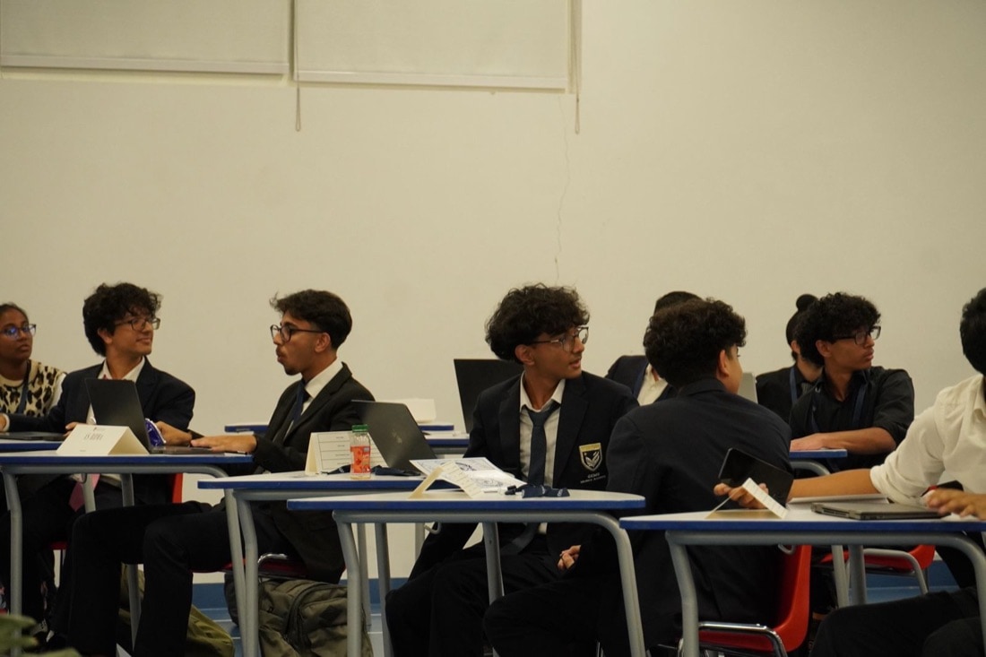 Delegates mid-debate in a GMAMUN committee session